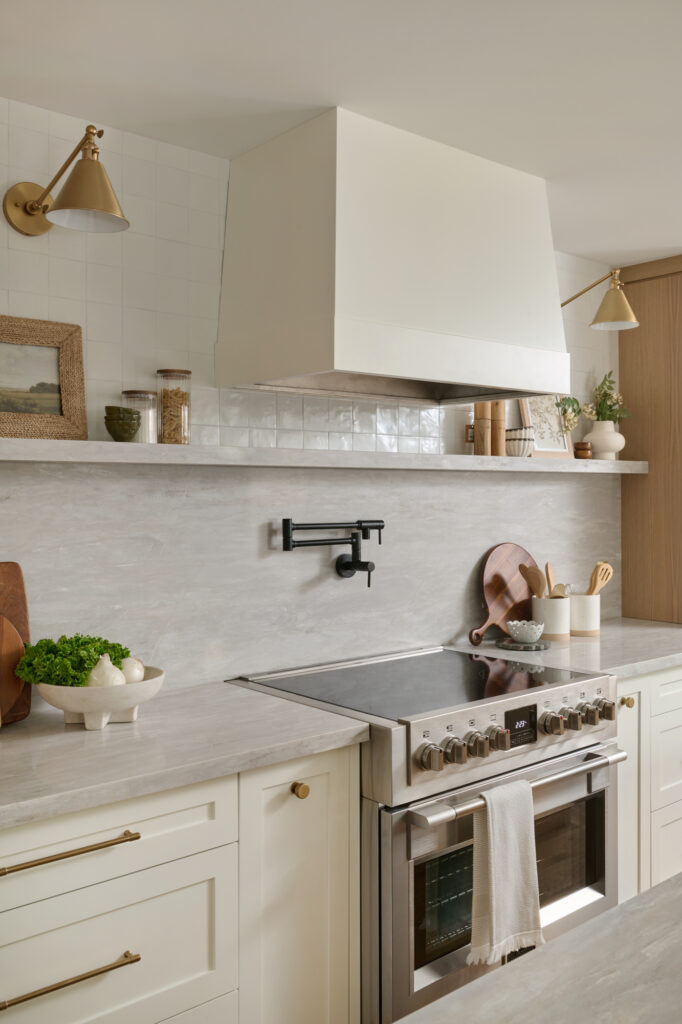 Custom range hood and stove with pot filler at Project Claremont by Whitby, Ontario interior designer Erin Interiors 