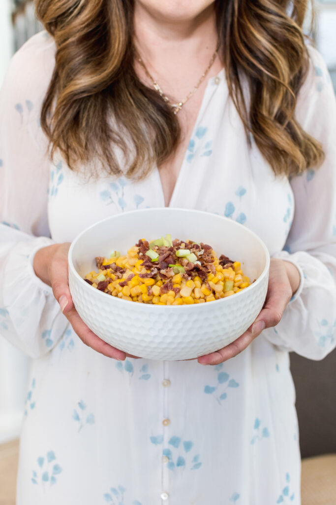 Whitby interior designer Erin Jones holds a bowl of Confetti Corn Salad, her favourite recipe for summer BBQs